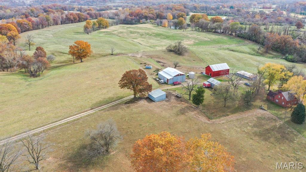 102.3 Acres M/L located at the intersection of Interstate 255 and Seminary Road outside of Alton. There is approximately 1800' of road frontage on Seminary Road and approximately 1400' of land bordering the onramp at the SE corner of I-255. This is a third generation family farm that has exceptional development potential. This farm is currently being used for agriculture and offers mature hardwoods, beautiful views, and a variety of wildlife.