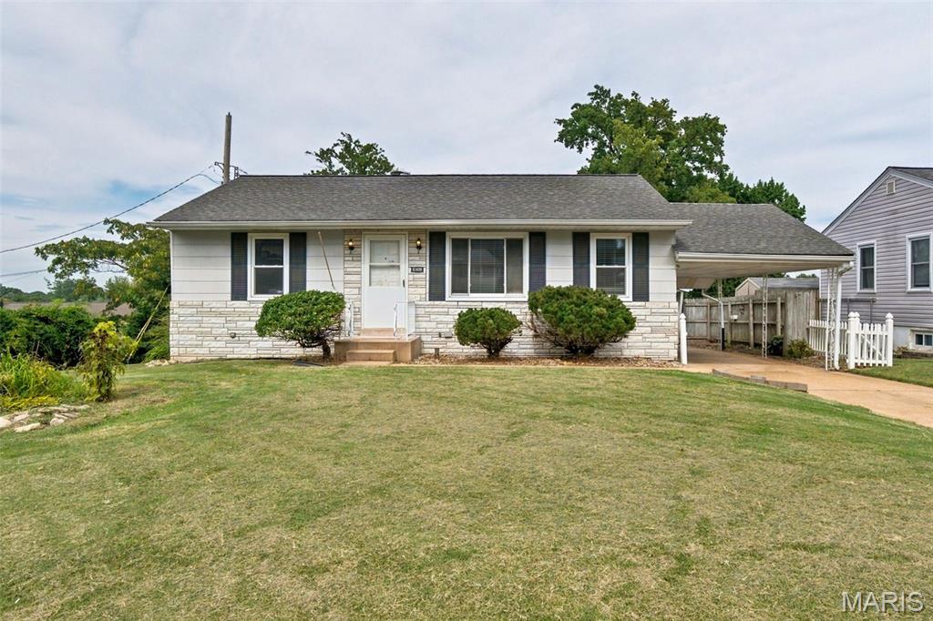 Welcome to your new home on Dandridge Drive! 2 Bedroom Ranch with possible sleeping area in lower level. This adorable home is ready for you to come add your personal touch! Step into the kitchen filled with classic vintage charm and personality! The cheerful retro custom painted cabinetry pairs beautifully with the timeless black and white checkerboard flooring creating a fun, nostalgic feel that is hard to find in most homes!  The lower level is partially finished offering a large family room area for entertaining as well as a possible sleeping room! Tucked just off the home is a unique enclosed garden room, surrounded by abundant windows that fill the space with natural light. This outdoor accessed retreat has the feel of a private greenhouse inspired sanctuary! Perfect for gardening or enjoying a peaceful space to enjoy the outdoors while being inside! Oversize one car garage and a bonus covered carport! New Roof and Gutters August 2026! Passing Occupancy.