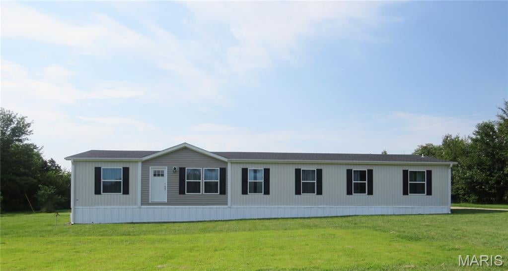 Enjoy the peace and privacy of a quiet country setting with this nearly new home situated on approximately 3 acres! Offering 4 bedrooms and 3 bathrooms, this spacious home features a bright, open-concept kitchen, living, and dining area that’s perfect for everyday living and entertaining. A separate family room provides additional space to relax, while dedicated office areas offer flexibility for working from home, hobbies, or study. With modern construction, plenty of room, and a beautiful acreage setting, this property offers the ideal combination of comfort, space, and country living!