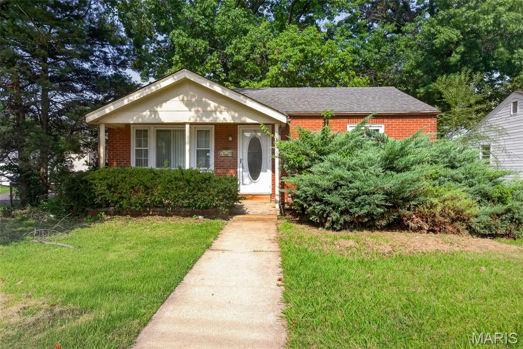 Calling all investors, landlords and sweat equity buyers. This home is in great shape but could use cosmetic updates. A fresh coat of paint, a bathroom freshup, and some basic landscaping will go a long way to provide more value here.  Previous rents in its current condition were $1025/mo. A nice sunroom sits at the back of this 2 bed, 1 bath home with a fully finished basement that has a walkout. There is a separate dining area attached to the living room as well. Out back is a fenced in yard and a HUGE 2 car garage, oversized, with two extra work rooms in the back and a side single garage door leading to the yard along with the 2 car entry door from the street. The home sits on a corner lot.  Sold as-is. We welcome buyer inspections.