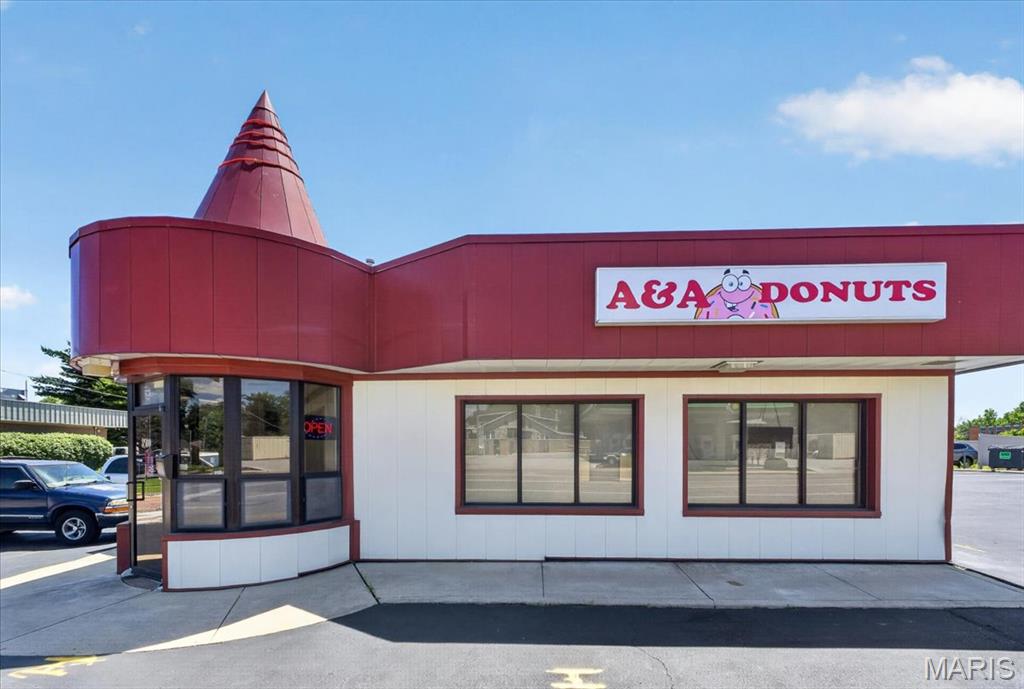 Prime Investment Opportunity on High-Traffic Morganford Road! Outstanding freestanding commercial building situated on a highly visible corner lot in the desirable Bayless area. This well-positioned property offers exceptional street frontage, strong traffic exposure, and a distinctive canopy that creates excellent curb appeal and brand recognition. Currently leased to a successful Donut House operation at $1,750 per month with annual 3% rent increases, providing immediate income for investors. Approximately four years remain on the current lease, and the tenant has expressed interest in continuing occupancy, making this an attractive turnkey investment opportunity. The building features two customer seating/retail areas, private office space, commercial kitchen, drive-thru window, ample storage, and approximately 12 off-street parking spaces. An additional 1,008± sq. ft. second-floor space offers valuable storage or potential auxiliary use. Conveniently located near Interstate 55, this property benefits from excellent accessibility, strong visibility, and consistent daily traffic counts. Ideal for investors seeking stable cash flow or future owner-users looking to secure a prime commercial location. Please do not disturb the tenant. Contact the listing agent for additional information or to schedule a private showing.