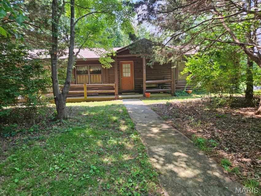 HOLIDAY SHORES:  Excellent opportunity to live at this unique lake community. In addition to 3 bedrooms, 2 full baths, this home has partially finished basement (including one of the baths) and a four season room with hot tub and gas fireplace.  Surrounding trees and quieter street provide lots of privacy and the deck is one spot to enjoy you serene backyard.  This home is located near Lake Access common land.  Check out www.holidayshores.us for C&R's including use of common land, boating rules and fun stuff to do.  Boat, ski, jet-ski, fish, kayak, swim.  One time initiation fee of $850 may apply.  Annual dues and assessments are $900 annually. Buyer & buyer agent to verify all information.