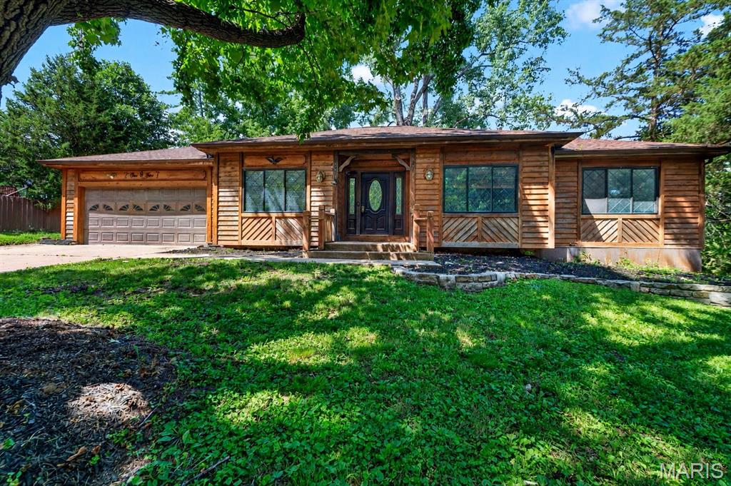 Welcome to 105 Willow Drive, a beautiful cedar ranch offering space, comfort, and a convenient location. This 3 bedroom, 2 bath home features 1,888 square feet on the main level with a spacious and functional layout throughout.

The front of the home offers two versatile rooms, giving you options for a home office, playroom, sitting room, formal dining area, hobby space, or whatever best fits your lifestyle. The large living room features a wood burning fireplace and provides plenty of room to gather. The kitchen includes a separate breakfast room, perfect for everyday meals or casual dining, and main floor laundry adds extra convenience.

The spacious primary suite includes a full ensuite bath and a large walk-in closet. Two additional bedrooms offer comfortable space for guests, kids, a second office setup, or extra storage. The unfinished walkout basement provides excellent storage, hobby space, or future potential. Outside, you’ll find a 2 car garage and a backyard shed for additional storage.

Conveniently located near shops, restaurants, and highway access, this spacious ranch is full of potential and ready for its next owner to make it their own.