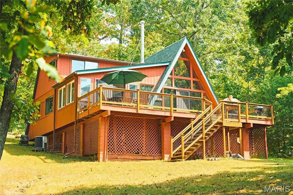 Lakefront Retreat – Just 1 Hour from St. Louis!

Bring the family and friends—this fully furnished A-frame lake cabin in the private, gated Anthonies Mill community is built for making memories. With 3 bedrooms, 1.5 baths, a cozy loft, and a bunk room that sleeps 9, there’s space for everyone. Recent updates include an updated kitchen, bunk room, all weather sun-porch, tinted windows, and washer/dryer.

Sitting on 1+ acre of prime lakefront, the property is a true kids’ haven with two zip lines, a flat yard for games, and walkable access to swings and a creek—giving kids freedom to play safely. A private dock and detached fish house make it easy to enjoy lake days with paddleboards, life vests, and everything else you need ready to go.

Enjoy fishing, boating, swimming, and water skiing on 110-acre Lake Ashley, plus other small fishing lakes, rivers for floating, beaches, community pool, pickleball court,  basketball, and more. With breathtaking sunrises and sunsets, this is the lake getaway your family has been waiting for!