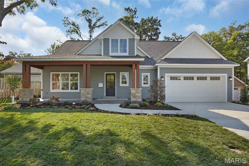 Within walking distance to coveted Tillman Elementary and North Kirkwood Middle Schools, this amazing New Construction home, now complete at 921 N Clay Ave, KRKWD, MO 63122, is a real Kirkwood marvel! This single-family residence with first floor primary suite is complete with 5 Bedrooms and 4.5 Baths.  Light filled open floor plan with 9' ceilings on main level, french white oak hardwood flooring on main level and 2nd floor hallway. Gourmet center isle kitchen with custom Amish cabinetry, KitchenAid appliances, custom built range hood, solid surface tops and tiled backsplash and access to covered patio.  Master Suite offers private bath with separate shower and freestanding soaking tub. Finished lower level includes bedroom, bath and rec room.  Plumbing fixtures from brands such as Kohler, Elkay, Moen and Delta in all bathrooms and Kitchen.  Designer-not builder grade tile selections used in all full bathrooms, first floor laundry room and mudroom.  The exterior stands out with Douglas Fir Timbers and James Hardie plank and shingle siding to last for many years to come with no maintenance or worries of hail damage.  Fully landscaped, sodded and irrigated partially fenced in beautiful yard on one of the best streets in Kirkwood! This is your chance to own a slice of the good life; inquire today and prepare to fall head-over-heels!