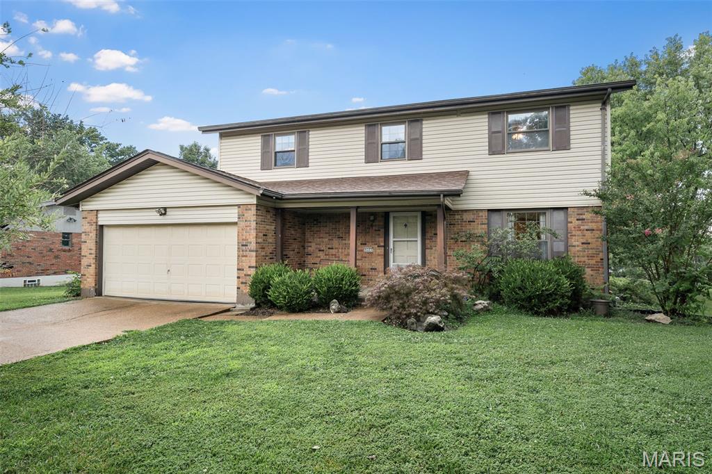 Spacious 2 story on a level corner lot in Crestwood. This 4 bedroom, 2.5 bath traditional brick/vinyl home is located in a spectacular neighborhood. Hardwood floors throughout the main level, living room with stained glass french doors. Newer kitchen with large center island, planning desk, pantry, 42" maple cabinetry, double oven and ceramic tile floors. The breakfast room is open to the oversized family room with fireplace and french door leading to the back patio and yard. Upstairs, the master suite is generously sized with a large walk in closet and full en-suite bath.  3 additional bedrooms and a 2nd full bath complete this level. The basement is unfinished, open and has full sized laundry. 2 Car Garage. This home has been well loved and is ready for a new owner. Showings start Friday 7/10.
