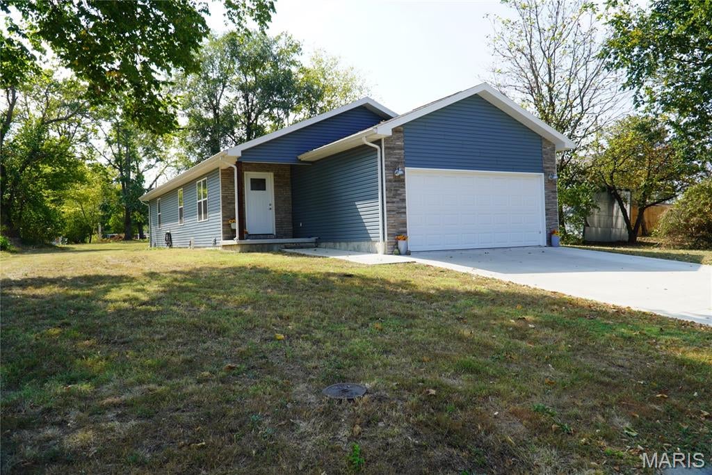 Look at this like new home in a growing neighborhood for under 250k. 3 bedroom, 2 bath, 2 car garage with an open concept build for a spacious and relaxed feel. The Home is all electric for your convenience. This home has quartz countertops in the flowing and well thought out kitchen. Quartz counter tops grace the bath rooms also.  There is an ample supply of cabinets with Heavy weight roll outs in kitchen as well as bath rooms.  Large pantry cabinet for keeping a good supply of food on hand. All appliances included. Cathedral ceilings in the living room, enlarge the feel of the home. All luxury vinyl flooring through out house so easy clean up for kids or pets. High efficient heat pumps for heat and air. In Lebanon school district and close to city parks and shopping.  Easy access to I44 hwy. Will qualify for all government loans.