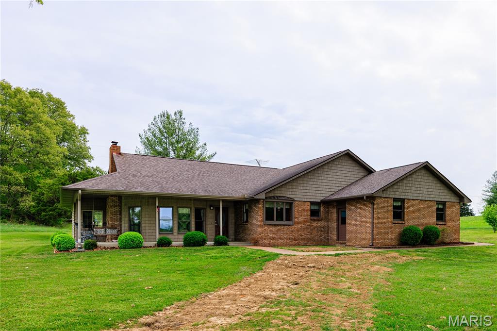 Set on 13.17 scenic acres with rear access to a county road, this meticulously maintained brick ranch
with vinyl shake siding offers a rare blend of craftsmanship, functionality, and privacy. Nearly 2,000 sq. ft
finished with 3BR 2BA. Built by the original owner and his brother, the home showcases exceptional
attention to detail and quality construction throughout.
The property features an attached oversized two-car garage, as well as a detached 24’ x 24’
garage/shop—ideal for additional storage, hobbies, or workspace needs. Enjoy peaceful outdoor living
from the covered front and side porches, perfect for relaxing in nearly any season.
Inside, the home offers two fireplaces: a wood-burning fireplace with blower in the family room, and a
gas fireplace in the sunroom/library. While the sunroom is not connected to the main ductwork, it is
efficiently cooled with air conditioning and comfortably heated by the gas fireplace, making it a
versatile, year-round space.
Numerous updates reflect the pride of ownership and ongoing maintenance, including: heat pump
(2023), water heater (2022), roof (2016), sump pump with battery backup (2025), pressure tank (2021),
well pump (2017), granite countertops (2017), appliances (2018), and all new lateral lines with
cleanout/inspection port (April 2026). Additionally, mature front-yard trees were professionally trimmed
in 2025, enhancing both safety and curb appeal.
This exceptional property offers the perfect combination of rural tranquility, thoughtful updates, and
enduring quality.