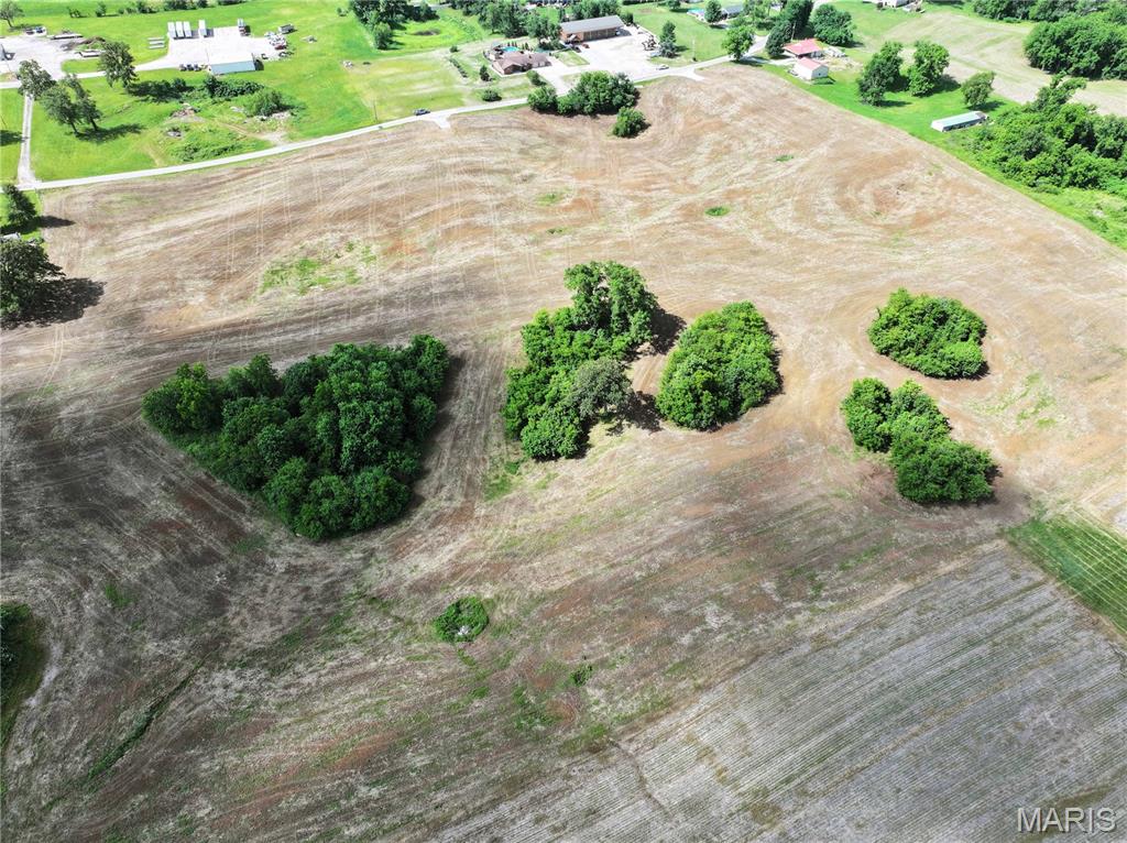 Discover the perfect blend of country living and convenience with this beautiful tract located just minutes from town and situated on a blacktop county road right off Highway 51. Whether you’re looking to build your dream home, start a small hobby farm, or invest in versatile acreage with endless potential, this property checks all the boxes.

The property will be surveyed prior to closing, giving buyers clearly defined boundaries and peace of mind. With no restrictions, you’ll have the freedom to use the land how you choose — from livestock and gardening to building a shop, barndominium, or custom home.

Utilities are readily available with public water located along the county road, electric nearby, and newly installed Spectrum internet lines providing access to high-speed internet in a rural setting. The combination of accessibility, infrastructure, and location makes this property a rare find.

Enjoy the privacy and open space of the countryside while still being close to shopping, schools, dining, and everyday amenities. Properties with this kind of flexibility and convenience are hard to come by — don’t miss your opportunity to own a great piece of ground with unlimited potential.