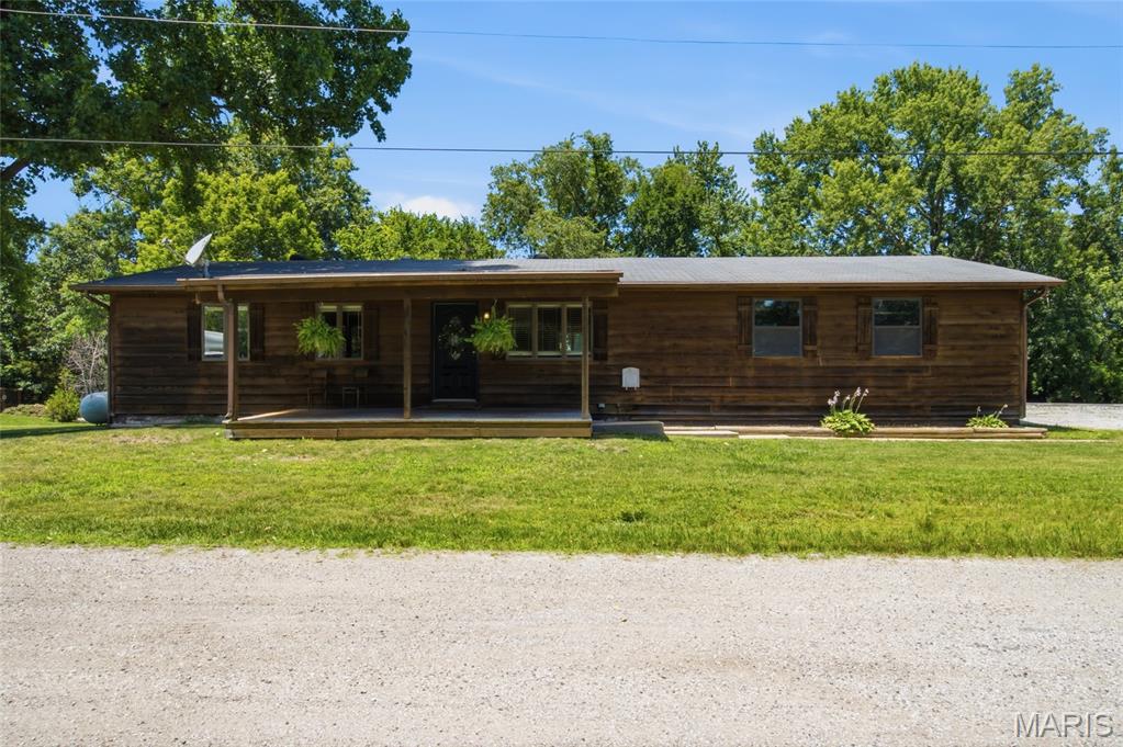 Welcome to 107 Red Deer Lane in O’Fallon, MO! If you have been looking for the perfect country setting with space, privacy, and endless possibilities, this 3 bedroom, 1.5 bath ranch-style home is one you will not want to miss. Sitting on a HALF ACRE lot backing to pastures, this property offers the peaceful setting buyers love while still being close to everyday conveniences. You are welcomed by a large covered front porch before stepping inside to a comfortable family living space that is perfect for everyday living. The kitchen offers an incredible amount of space, making it ideal for large gatherings, hosting, and entertaining. With plenty of countertop space, a pantry, stainless steel appliances, and an abundance of natural light, this room truly brings the heart of the home together. From the kitchen, guests can easily flow out onto the back deck, creating a great indoor-outdoor living setup. The primary bedroom features its own private half bath and direct access to the deck, giving you a peaceful place to enjoy the serene setting. Along the hall you will find the 2 additional good-size bedrooms! The hall bathroom provides a soaking tub/tiled shower combo. The full unfinished basement offers plenty of storage space or would make an amazing workshop or home gym! Additional highlights include an oversized 2-car garage, spacious yard, and plenty of privacy from neighboring homes. Bonus- NO HOA restrictions! Feel free to store what you want here or run your business from this property. Seller strongly prefers an as is sale, but the seller will ensure Septic & Well are up to code and provide Certificate of Occupancy with St Charles County. This is YOUR chance for country living in Ofallon, MO!