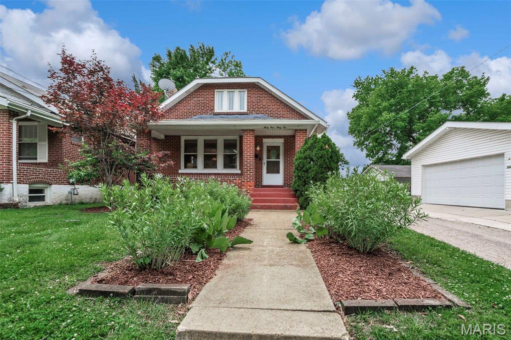 DOGTOWN DREAM COME TRUE! This beautifully updated 1.5-story home is full of charm, character, and modern touches throughout. Features include newer hardwood floors, newer flooring in the main-floor bedrooms, updated kitchen flooring, and newer windows. The inviting living room flows seamlessly into the formal dining room through a stunning arched entryway. The updated kitchen offers newer cabinetry, stove, dishwasher, disposal, and microwave. Spacious primary bedroom features a large organized closet, plus an additional bedroom on the main level. Upstairs you’ll find a versatile layout with a 3rd bedroom, sitting room, and den/office that could easily serve as a 4th bedroom. Abundant closet space throughout! Step outside to a large rebuilt deck overlooking the level, fenced backyard—perfect for entertaining. Newer fencing and off-street parking add convenience. Walk-out lower level offers additional possibilities. Prime location with easy access to Hwy 40/44, Forest Park, restaurants, shopping, and all that Dogtown has to offer!