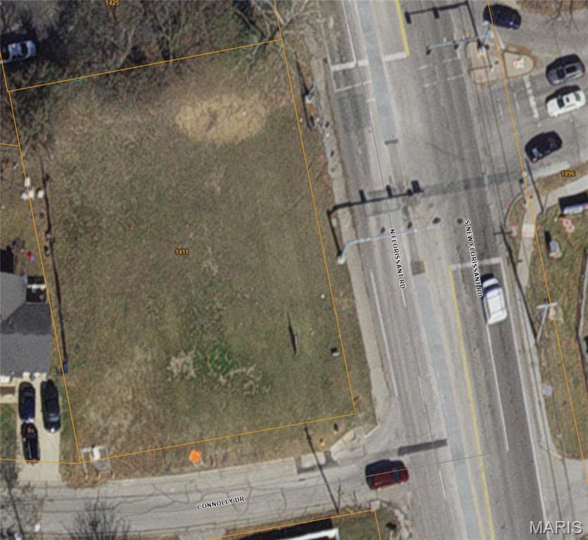 Imagine the possibilities for this high-visibility corner lot that's passed by nearly 10,000 vehicles every day. Zoned both commercial and residential, it could be perfect for a mixed-use building. Maybe a laundromat on the main level and apartments upstairs? Or keep it all retail and build a drive-through coffee stand here! Located on a busy commuter route, right off of Highway 270, this lot also sees a high amount of pedestrian traffic from the nearby high school. Measuring 115 x 167 feet (almost a a half acre), it offers tremendous potential. Utilities available nearby. Fronted by a three-way signalized intersection.