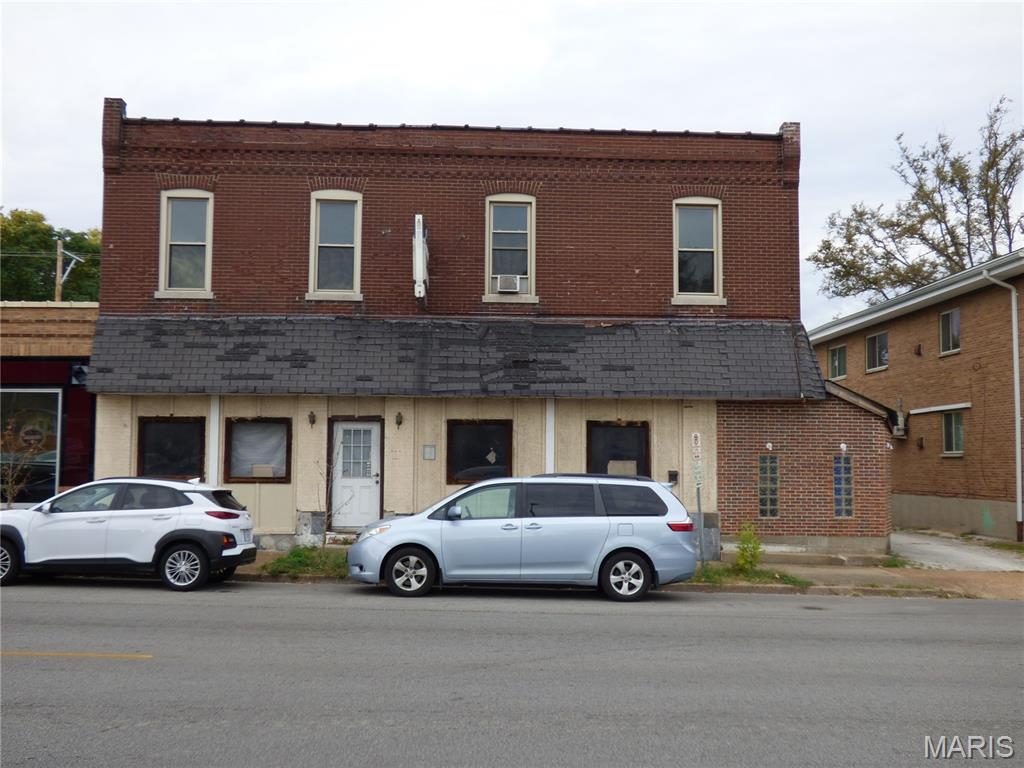 First floor commercial space (~2,000 Sqft)  ideal for Bar/restaurant or retail with ~4000SqFt private parking lot in the back. Second floor includes 2 independent apartment units (1bed/1bath, ~550 Sqft and 2 beds/1bath, ~1,000 Sqft). 

Parcel includes 3219, 3223 and 3225 Morgan Ford. 

Sold as-is