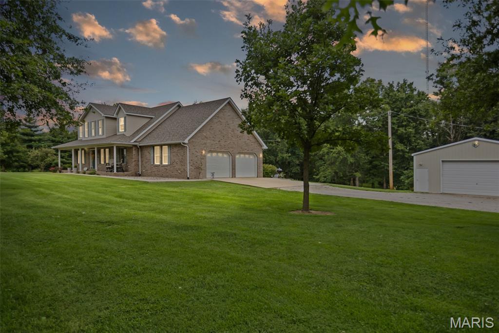 Nestled on 6.1 private, wooded acres, this beautifully situated 1.5-story home offers space, versatility, and endless potential. This one owner home features 3 bedrooms and 2.5 bathrooms, with a desirable main-level primary suite for added convenience. Upstairs, you'll find two bedrooms and a full bathroom, along with a loft/sitting area that overlooks the foyer and living room. The inviting living room features a fireplace and windows overlooking the backyard, while the separate dining room provides the perfect space for gatherings and entertaining. Just off of the garage you'll find a half bath and laundry room that includes a utility sink for added functionality. Step outside onto the spacious composite back deck and enjoy the peaceful, tree-lined setting and privacy that surround the property. The unfinished walkout basement offers an incredible opportunity to create additional living space, a recreation area, home gym, or workshop, with a rough-in already in place for a future bathroom. Additional highlights include geothermal heating and cooling, central vacuum, a 2-car attached garage, and an impressive 30' x 32' detached garage featuring electricity and a concrete floor-perfect for vehicles, equipment, hobbies, or extra storage. With 6.1 acres, mature trees, multiple garage spaces, and abundant potential, this property offers the rare combination of privacy, functionality, and room to make it your own.