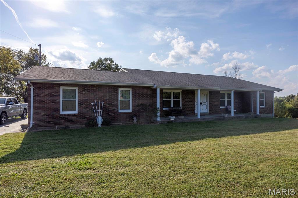 Discover the potential of this beautifully built brick home situated on approximately 5 acres in a peaceful country setting just outside of Perryville. This 3-bedroom, 2-bath home offers solid construction, spacious rooms, and beautiful views of the surrounding countryside.

While the home is ready for its next owner to bring their own updates and personal touches, it features plenty of character, including a wet bar and fireplace in the living room. Downstairs, the full walk-out basement features a wood-burning stove surrounded by beautiful masonry and offers an abundance of unfinished space. With the potential to finish the basement, there is an excellent opportunity to nearly double the home's finished living area.

Outside, the approximately 5-acre setting provides plenty of room to enjoy country living while remaining conveniently located just a short drive from Perryville.

If you've been searching for a well-built brick home on acreage with beautiful views, room to grow, and the opportunity to make it your own, 48 PCR 852 is one you'll want to see.