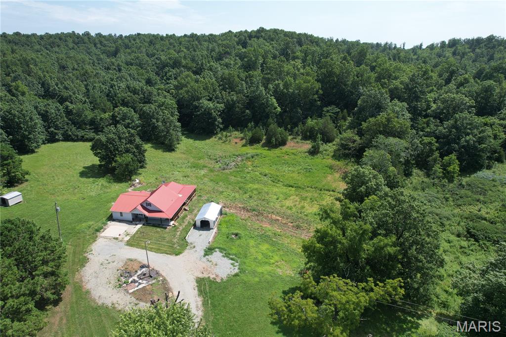 MADISON MINI-FARM 11

Escape to the peace and privacy of country living with this beautiful 3-bedroom, 2-bath home situated on just over 11 scenic acres. Inside, you'll find a spacious floor plan featuring a well-appointed kitchen, a large primary suite with a private office, and two walk-in closets, providing plenty of space for work and relaxation.

Step outside and enjoy the huge covered porch, the perfect place to sip your morning coffee, entertain family and friends, or simply take in the peaceful views of your acreage. The property also includes a playground, making it an ideal place for children to play and create lasting memories.

Outdoor enthusiasts will appreciate the abundant wildlife, with excellent opportunities for deer, rabbit, and squirrel hunting right on the property. Located just minutes from the beautiful Castor River, you'll have easy access to fishing, floating, kayaking, and countless outdoor adventures.

Whether you're looking for a full-time residence, a mini farm, or a private weekend retreat, this property offers the perfect combination of comfort, recreation, and country charm. Don't miss your chance to own your own slice of the Missouri outdoors!