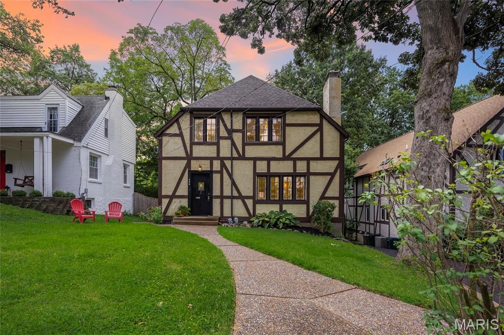 Welcome to 336 Newport Avenue, a storybook Webster Groves home filled with timeless character, thoughtful updates, and the architectural charm buyers search for in one of the St. Louis area’s most desirable communities. Ideally located near Old Webster and Old Orchard, this 3 bedroom, 2 full bath residence showcases a classic half-timbered stucco exterior, leaded glass windows, original hardwood floors, beamed ceilings, and a decorative fireplace with stone mantel.

The inviting main level offers comfortable living and dining spaces with warm natural light, historic detail, and an easy flow for everyday life or entertaining. The kitchen blends style and function with granite countertops, stainless steel appliances, slate flooring, and custom cabinetry. An original built-in butler’s pantry/dry bar connects the kitchen and dining room, adding vintage appeal, extra storage, and a memorable serving area for hosting. The second level keeps all three bedrooms together, offering comfortable separation from the main gathering spaces below.

Major improvements include new HVAC and a tankless/instant water heater, adding comfort, efficiency, and peace of mind. Outside, enjoy a lovely, secluded, fully fenced yard with room to relax, garden, entertain, or let pets play. Additional highlights include a 1-car tuck-under garage, off-street parking, a level lot, and service by Avery Elementary, Hixson Middle, and Webster Groves High School. The home has also passed the stringent Webster Groves occupancy inspection.

Known as the “Queen of the Suburbs” and celebrated as the “City of the Arts,” Webster Groves offers a sought-after lifestyle with tree-lined streets, walkable neighborhoods, local parks, renowned boutiques, acclaimed dining destinations, community events, and a convenient central location near major highways, Clayton, downtown St. Louis, universities, hospitals, and surrounding business corridors.

A standout combination of classic Webster Groves charm, meaningful updates, private outdoor space, walkable convenience, garage parking, and move-in confidence. Active and ready for showings. Schedule your private tour today.
