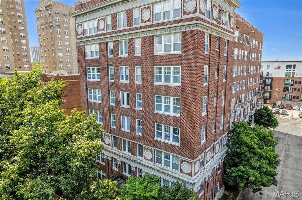Sophisticated, spacious condo in the heart of popular DeBaliviere Place! This beautifully updated unit features a great layout, with two beds, two baths and TWO balconies! Only a few units in the building have balconies, so don't miss the chance for a home that includes sought-after outdoor living space! You'll love the sleek, laminate floors in the living areas and new carpet in the bedrooms! Low condo fees include water, sewer and trash. Enjoy maintenance-free living in a well-managed building, just steps from beautiful Forest Park! You'll love the quiet street and the convenience to Central West End, Wash U and public transportation! Condo includes a rock-star assigned parking space in the secure, gated parking lot. Wash U employees can enjoy $12,500 in employer-sponsored down payment assistance - Live Where You Work! Easy to show! Location: End Unit