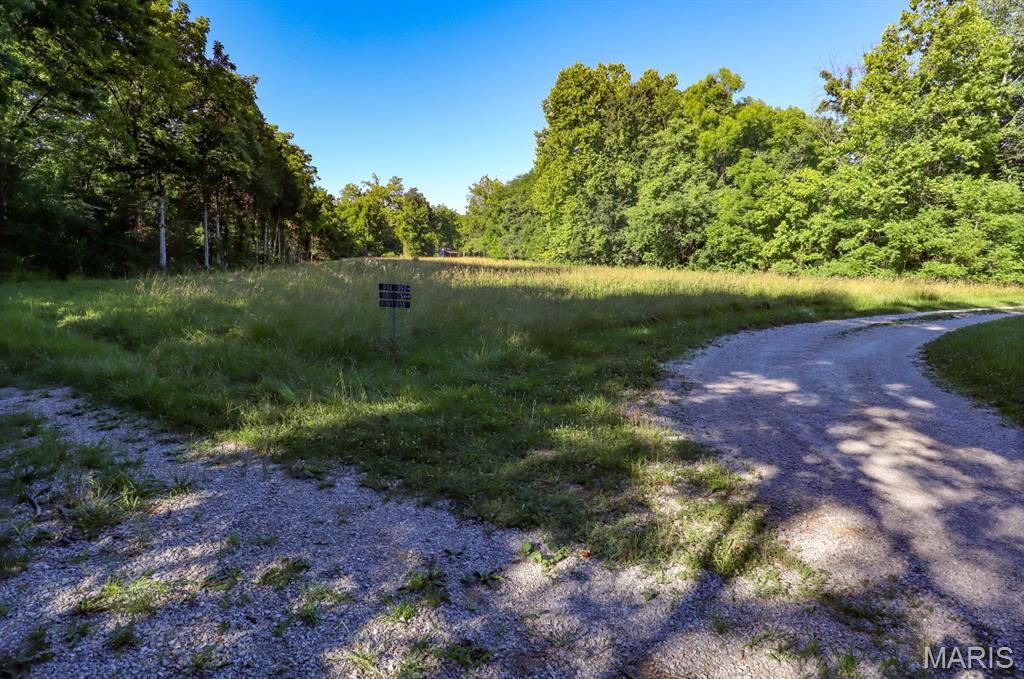 Tucked away in the peaceful countryside of Marthasville, Missouri, this versatile farm offers an outstanding combination of recreational opportunities, future homesites, and privacy. With a blend of mature timber, open fields, and a small pond, the property provides the ideal setting for outdoor enthusiasts, weekend retreats, or those looking to build in a quiet rural setting. The farm's diverse habitat creates excellent hunting opportunities for whitetail deer and wild turkey. Timbered cover, natural travel corridors, and strategically placed openings provide the ingredients necessary to attract and hold wildlife throughout the year. Whether you're an experienced hunter or simply enjoy observing wildlife, this property offers countless opportunities to enjoy the outdoors. Several potential build sites are scattered throughout the farm, allowing you to create your dream home, cabin, or hunting retreat while maintaining privacy and seclusion. Its secluded setting offers a sense of tranquility that is increasingly difficult to find. Mature timber surrounds much of the acreage, creating a private atmosphere and a true escape from the demands of everyday life. The open fields provide flexibility for food plots, recreational use, pasture, or other land management goals, while the small pond adds both wildlife value and aesthetic appeal. Despite its private feel, the property benefits from convenient access, making it easy to enjoy year-round. Whether you're searching for a hunting property, a future homesite, or a recreational getaway, this Marthasville farm offers a rare opportunity to own a well-rounded piece of Missouri countryside in a highly desirable location. To schedule a private showing, call Cody West.