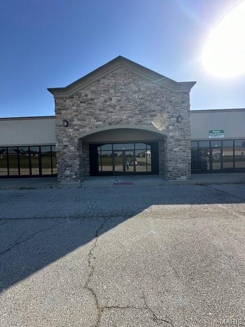 For sale in the thriving Stonehurst development in New Haven, MO is this 2500 square feet of finished space that could be used for a wide variety of businesses!  

This 50x50 space features a glass store front, arched stone entryway, and a handicap accessible bathroom along with a completely built out space that could be used as an entrance foyer, customer greeting area, hostess table, bar and grill, glassed in office, meeting room, retail storefront and more! This property could be divided into 2- 1250 square ft spaces or divide even further for a business center, contractor space, climate controlled storage, and more!

This space is in a high traffic retail/ business center near Hwy 100 with several established and successful businesses in the same development including a liquor store, cafe/ coffee shop, print shop, 24 hour gym, and a hair salon.  Other nearby businesses include Dollar General, Investment Firm, Grocery Store, an assisted living facility, as well as the new Ambulance base.
This building is Zoned C3 and is suited for a variety of businesses including retail, restaurant, warehouse, wholesale distribution, repair facility, contractor space, office space, medical facility, HVAC shop, Laundromat, and many more!

This space is very energy efficient in construction and offers 2 Rooftop HVAC units, 3 phase/ 1 phase electric, lighting throughout, LVP flooring in front entrance area, and fiber internet.  It also has a large rear area that is finished but with concrete floor suitable for a large variety of uses including commercial kitchen, seating, warehouse, distribution, shipping and receiving, storage, contractor storage, or many other uses.

Property is also listed separately for lease.  An additional adjoining 1250 square feet is currently also for sale but not a part of this listing.  (See MLS # 25058917)

Contact us TODAY for more information!