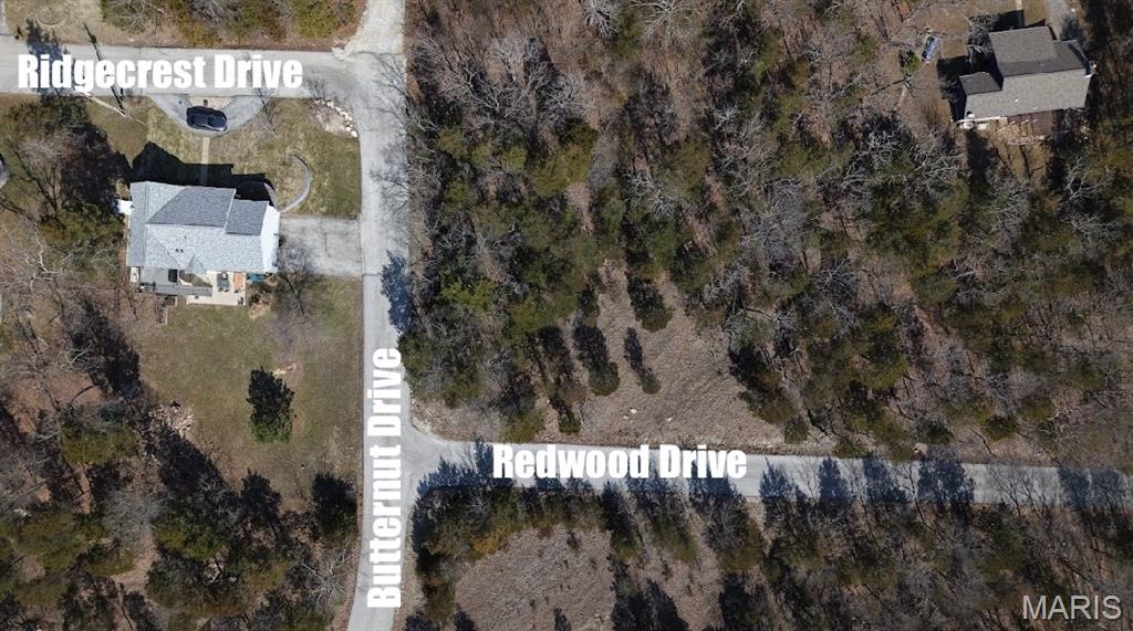 Large Corner Lot with Utilities Nearby: Right down from the Big Lake, Golf Course, and New Construction! Buy as an individual lot for lake access or check out the nearby lots to purchase as a package and save, save, save! This oversized lot is a ready-to-build home site and is a leveled buildable lot located in this private, gated, resort-style community with breathtaking views four lakes, white sandy beach area, breathtaking golf course views, campgrounds, swimming pool, fitness center and more. Amongst the many more luxury amenities. Perfect for builders to market to anyone seeking a peaceful, recreational lifestyle away from St. Louis, but still very close for easy family visits. Also perfect for get-away lake home. Enjoy the golf course, lake, boating, fishing, clubhouse, pool, etc. Just 20 minutes from The Heart of Saint Louis! Oversized corner lots like this one with double access are rare to find with such serene views. Check out more of the similar lots available in this Developers Paradise perfect for a Builders Package or a Custom Home.