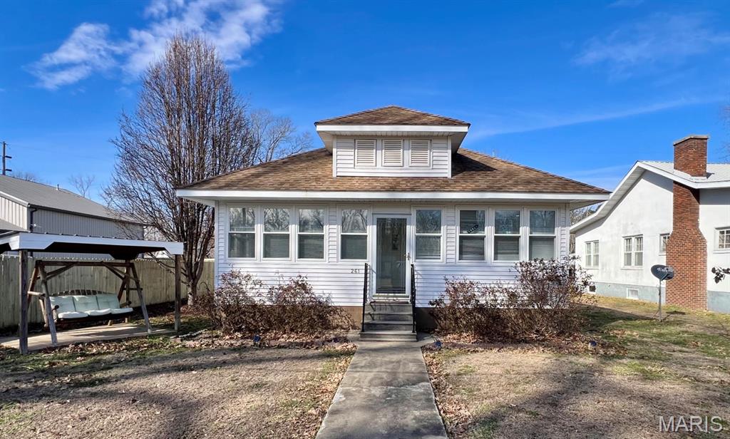 This nicely maintained 3-bedroom, 2-bath home offers comfort, functionality, and pride of ownership throughout. It has many nice updates including the windows and central A/C making it energy efficient and move-in ready. 
The home features a bright, welcoming enclosed porch and open living spaces with 9 foot ceilings. The kitchen has solid wood cabinets, an updated countertop, a newer gas range, refrigerator, and microwave. The pantry/laundry room has a newer water heater (2024) and washer and dryer included. The utility room has a built-in cabinet offering more kitchen prep and storage. Most furniture pictured, including some quality vintage, is included in the sale at the buyer’s discretion, making this an excellent opportunity for a furnished option.
The back of the property features a 24x23 concrete-block shop, with built in shelving perfect for storage, hobbies, or a workspace. Also, a double carport with enclosed front offers convenient covered parking with a covered walkway to the door. The front of the home has a fixed, shaded outdoor swing which adds to the charm and enjoyment of the outdoor space.
A well-kept home with updates and versatile extras in a quaint little town—this property is a must-see!