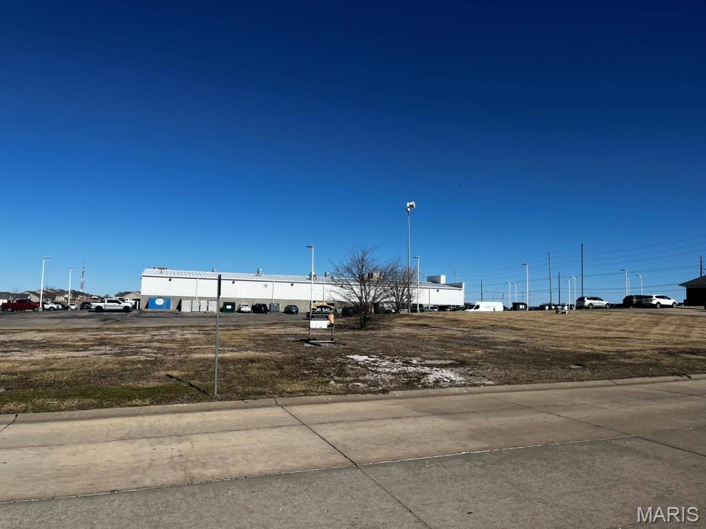 Prime Commercial Corner Lot in Waterloo! Located at the bustling north end of Waterloo, this expansive corner lot offers outstanding visibility and accessibility just off Route 3, at the intersection of Warren Drive and Jamie Lane. Neighboring landmarks include Dietrich Bank at the front of the property, the Sunset Ford Dealership next door, and the Super 8 Motel conveniently across the street. This high-traffic area ensures excellent exposure for your business, with easy access and prominent highway visibility. A perfect opportunity for commercial development in a thriving area!