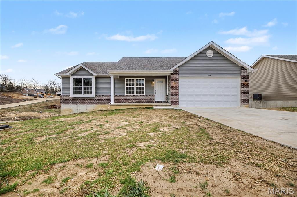 (Seller is offering a closing cost credit with an  acceptable contract by June 30th) 
Welcome home to this stunning 3-bedroom, 2-bath ranch with an attached 2-car garage! The exterior offers low-maintenance vinyl siding accented with decorative brick trim, along with enclosed soffits and fascia for added durability.
Step inside to a spacious great room featuring vaulted ceilings, recessed lighting, and attractive luxury vinyl plank flooring that flows throughout the main living areas. The kitchen is bright and inviting with gleaming white cabinetry, recessed lighting, and an adjoining dining area with a sliding glass door leading out to the deck over looking your back yard—perfect for entertaining or relaxing outdoors.
The main level includes three comfortable bedrooms, including a primary suite with its own full bath.
The walk-out lower level provides excellent potential for additional living space, featuring a fully framed back wall, egress windows, and a sliding door for natural light and easy access outside. Plumbing is already roughed in for a future full bathroom—just bring your finishing touches to make it your own!