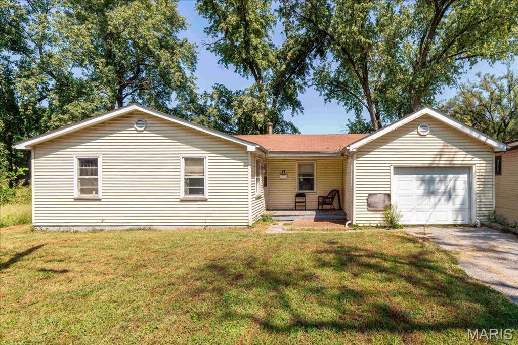 Located in Cahokia, this fully refreshed 1,048-square-foot residence seamlessly combines low-maintenance living with comprehensive modern upgrades. Benefiting from top-to-bottom renovations, this move-in-ready home features an updated layout, brand-new interior doors, fresh baseboards, and a complete interior paint refresh. The updated kitchen shines with brand-new cabinetry, modern countertops, a fresh sink and faucet, updated light fixtures, and a new exhaust fan, while the bathroom boasts a stylish new vanity. Key system and exterior enhancements include energy-efficient new windows, new exterior doors and locksets, upgraded insulation, a full electrical upgrade, a new thermostat, fresh smoke and CO2 detectors, and clean guttering. Situated on an expansive lot with mature shade trees and clean landscaping, this updated property offers an incredible turnkey opportunity for both owner-occupants and investors alike.
