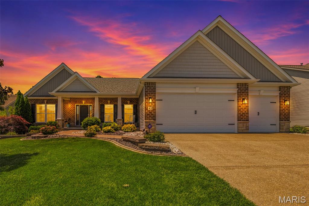 Welcome to 43 Deerfield Ct. — a beautifully maintained 5-bedroom, 3-bath ranch home with an additional flexible bonus room ideal for a home office, playroom, media room, or gym, offering over 4,200 square feet of finished living space in the highly rated Wentzville R-IV School District. Tucked away on a quiet cul-de-sac and backing to wooded common ground, this home combines privacy, flexibility, and room to grow.
The main level features a desirable divided-bedroom floor plan, spacious living areas filled with natural light, and convenient main-floor laundry. The gorgeous kitchen is beautiful with premium Cambria quartz countertops, tile backsplash, and ample space for gathering and entertaining.  Just off the kitchen, the enclosed sunroom opens to a composite deck overlooking the large 0.32-acre lot and peaceful wooded backdrop, creating the perfect setting for relaxing or entertaining outdoors.  The private primary suite includes a luxury bath with double vanity, soaking tub, and separate shower.

The finished walk-out lower level adds incredible versatility with impressive 9-foot ceilings, a large recreation area, two additional bedrooms, a full bath, and a bonus room already wired for sound. One of the lower-level bedrooms features an exceptionally large closet and offers excellent flexibility for guests, hobbies, storage, or additional living space. Whether you need a media room, office, workout space, playroom, guest suite, or additional sleeping area, this lower level easily adapts to your needs. The space also offers excellent potential for a future kitchenette or extended guest accommodations.

An extra-deep 3-car garage provides plenty of room for vehicles, storage, and hobbies. Additional updates and features include a newer roof (2 years old), recently serviced HVAC system, integrated pest control system, full-property irrigation system, enclosed sunroom, and composite deck.

With flexible living spaces, major updates already completed, and a premium cul-de-sac setting backing to nature, 43 Deerfield Ct. is move-in ready and designed for everyday comfort, entertaining, and the next chapter ahead.