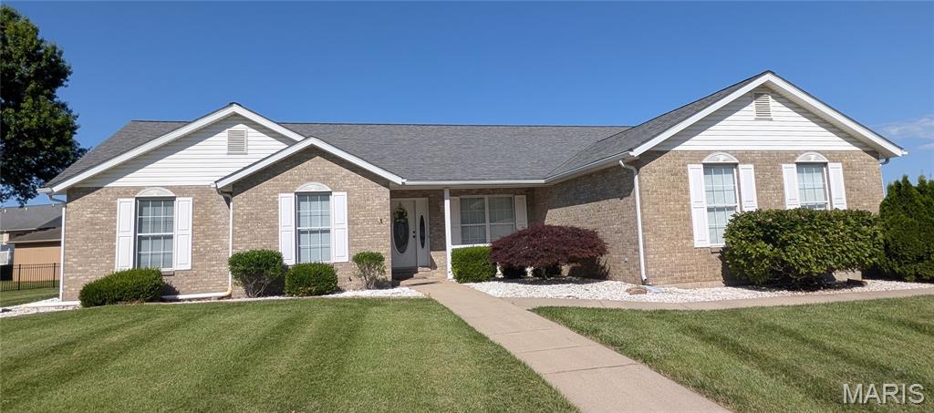Very nice 4 bedroom 3 1/2 bath brick home located in Waterloo School District and one block away from Gibault Catholic High School on a 0.41 acre lot.  This lovely home features vaulted ceilings in a large 320 square foot family room which includes a fireplace and leads into an eat-in kitchen.  Your guests are welcomed through the front door to the formal dining room (which with a little remodeling could be turned into a nice home office).  The spacious master bedroom includes a large double vanity master bathroom, a whirlpool tub and shower, plus there is a 45 sq foot walk-in closet and the bedroom opens to a private deck out back.  This well cared for home includes a gas fireplace, attic fan, central vacuum system, a custom brick mailbox, and about 1,000 square feet in the basement for either storage or could be finished to add even more living space.  Additionally, the three car garage has 9 1/2 foot ceilings and some attic space and out back there is a storage shed.