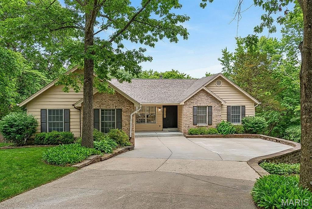 Luxury Lakefront Living on Lake Whippoorwill in the prestigious Innsbrook subdivision. This fully renovated 3-bedroom, 3-bath residence is a rare offering, perfectly positioned on over an acre of prime waterfront and boasting over 2,500 square feet of thoughtfully designed living space. The open-concept floor plan is enhanced by expansive windows and skylights, filling the home with natural light and showcasing breathtaking lake views from nearly every angle. The living room serves as a warm and inviting centerpiece, featuring a charming wood-burning fireplace flanked by custom built-ins—perfect for cozy evenings and stylish storage. The beautifully updated kitchen is designed for both style and function, highlighted by a large center island ideal for gathering and entertaining. A sun room provides a serene, light-filled retreat, seamlessly blending indoor comfort with the beauty of the outdoors. The primary suite offers a private sanctuary, complete with a luxurious ensuite bath and a spacious walk-in closet. A generously sized second bedroom on the main floor provides flexibility for guests or additional living space. A fully renovated second bathroom adds both convenience and elevated style, while main floor laundry enhances everyday ease and functionality. The walk-out lower level expands the home’s living space, featuring a private bedroom, full bathroom, and a spacious family room—perfect for guests, recreation, or a secondary living area with direct access to the outdoors. Step outside to the dramatic two-story deck spanning the entire back of the home—an exceptional space for elevated entertaining or relaxing while taking in the tranquil waterfront setting. Residents of Innsbrook enjoy an exclusive lifestyle with access to resort-style amenities including a public championship 18-hole golf course, restaurants, pool, pickleball courts, fitness center, playground, and outdoor amphitheater—hosting live music, seasonal events, and year-round entertainment. Explore multiple lakes, sandy beaches, and scenic walking trails, all just moments from your door. Every detail has been carefully renovated to deliver a true turnkey experience, combining modern luxury with the peaceful charm of lakeside living. An extraordinary opportunity to own a private waterfront estate in one of Innsbrook’s most coveted locations.