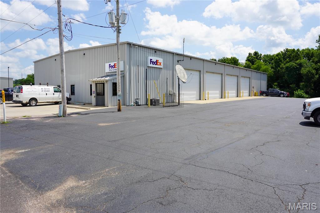11,900 m/l sq. ft. industrial warehouse on 1.81 m/l acres with convenient access to I-44 and Highway 63. The building offers approximately 10,150 m/l sq. ft. of warehouse space and 1,750 m/l sq. ft. of office space featuring a reception area, five private offices, conference room, break room with kitchenette, two restrooms, and a floored mezzanine for additional storage.

The warehouse includes eight drive-in overhead doors, two loading docks, gas infrared heat, and a layout designed to accommodate a variety of industrial operations. The office area is served by central heat and air. The level site provides paved parking and ample room for deliveries, equipment, fleet vehicles, and employee parking.

Located in Rolla's established industrial corridor with quick access to Interstate 44, this property is well suited for warehousing, distribution, manufacturing, contractor operations, equipment sales and service, logistics, fleet maintenance, fabrication, and other industrial or commercial uses.