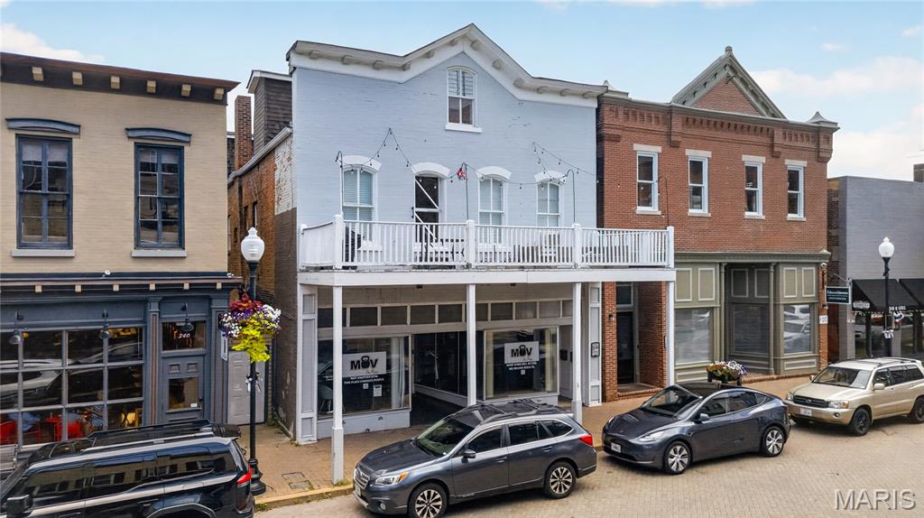 334 N Main Street presents a rare opportunity to acquire a historic, income-producing mixed-use building in the heart of downtown St. Charles. Originally constructed in 1835, this brick building totals approximately 5,712 square feet across two floors plus a full lower level of approximately 2,850 square feet, situated on a 0.093-acre parcel with direct N Main Street frontage.

The upper floor is fully utilized as Airbnb and shorter-term apartment units, generating a true net operating income of approximately $42,000. The first floor offers approximately 2,862 square feet of turn-key gym space – a dramatic 90-foot-deep open floor plate with two private offices and a restroom – supported by locker rooms and showers in the lower level. This space is being marketed for lease at $25.00 per square foot NNN; a signed gym tenant would add roughly $70,000 of annual income, more than doubling NOI and giving an investor immediate, executable upside on day one. At the $950,000 asking price, that translates to approximately $166 per square foot – well below replacement cost for historic Main Street product.

Zoned General Commercial (AB2), the property supports a broad range of retail, service, fitness, hospitality, and residential uses. The location benefits from 77,283 vehicles per day along the adjacent Riverside Drive corridor and a Walk Score of 79, reflecting the district’s exceptional year-round pedestrian activity.

Downtown St. Charles draws millions of visitors annually with its brick-paved streets, riverfront festivals – including the nationally recognized Christmas Traditions celebration – and its position along the Missouri River and Katy Trail. Neighbors include Mov on Main, Climb So iLL at the Steel Shop, and the district’s dense collection of boutiques, restaurants, wineries, and entertainment venues, with SSM Health St. Joseph Hospital anchoring the corridor to the south.

With stabilized short-term rental income upstairs, a turn-key gym opportunity below, and irreplaceable Main Street real estate, 334 N Main is a compelling acquisition for investors seeking both current cash flow and meaningful near-term growth.