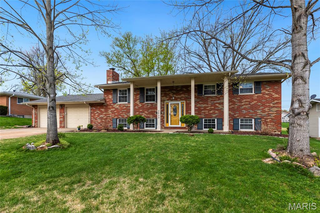 Stunning home located in the popular subdivision of Elmwood Manor in St Charles! This home boasts 5 bedrooms, 3 bathrooms, and over 2,400 square feet of living space.

The front door opens to the entry foyer, which leads to the living room with hardwood floors, a wood burning fireplace, crown molding, and opens to the kitchen. The kitchen was updated in 2023, and features quartz countertops, tile backsplash, 42 inch cabinetry, stainless steel appliances, a gas range, luxury vinyl plank floors, crown molding, new hardware, and a new sink. 

The primary bedroom boasts a spacious closet and a full bathroom. Two additional bedrooms and a full hall bathroom complete the upper level. 

The lower level features recreation room with a wood burning stove and crown molding, two additional bedrooms, a full hall bathroom which was updated in 2022 with a new shower and new vanity, and ample storage space.

Other highlights include: oversized 2 car garage, new Trex deck (2025), new AC unit (2024), newer water heater, newer blinds, hardwood floors throughout most of the upper level, new luxury vinyl plank floors throughout most of the lower level (2022), and most of the interior has been repainted.

Relax outside on the concrete back patio or on the new Trex deck and enjoy the spacious, level backyard. The backyard also features extensive landscaping, a garden, and 2 apple trees. Location could not be better – close to major highways, restaurants, shops, schools, and walking distance to Jaycee Park.