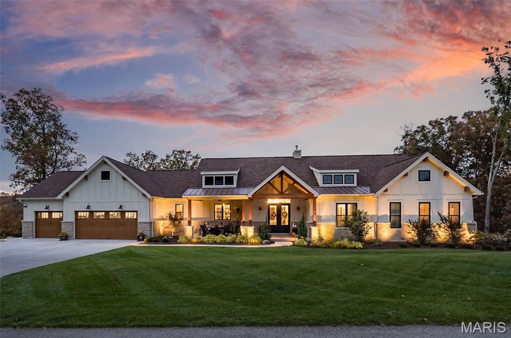 OPEN HOUSE - Saturday 6/20 1:00-3:00!!

Welcome to your private retreat on 2.58 acres in Troy where peaceful country living meets thoughtful design and incredible recent upgrades. Surrounded by woods, this property invites you to slow down, spread out, and truly enjoy where you live.

Inside, a dramatic great room makes an unforgettable first impression with soaring ceilings, exposed Douglas fir beams, a striking masonry stone fireplace, and walls of windows that fill the space with natural light. The open floor plan flows seamlessly into the chef’s kitchen, featuring a large center island and newer premium Thermador appliances, including refrigerator, range, dishwasher, and a sleek microwave drawer. The walk-in butler’s pantry offers added cabinetry and a beverage refrigerator. You’ll love the organized mudroom off the garage with custom cabinetry, granite counters, utility sink, and doggy bath, along with a beautifully finished main-floor laundry room complete with additional cabinetry, granite counters, a sink, and space for a morning espresso bar.

The main level has been thoughtfully enhanced with new hardwood flooring, fresh paint, and designer lighting. The primary suite is a true retreat with two organized walk-in closets and an exquisite bath. Bedrooms 2 and 3 share a Jack-and-Jill bath with double sinks.

The outdoor spaces truly set this property apart. An oversized sliding door opens to the spacious screened-in porch—perfect for enjoying the sounds of nature—while the deck is ideal for grilling and dining overlooking your own resort-style backyard. Highlights include an impressive infinity-edge in-ground pool with wide sunning stairs and fire and water bowls, hot tub, expansive decking, and a massive outdoor masonry fireplace. A lawn irrigation system keeps the extensive landscaping and lawn improvements lush. Low-voltage lighting enhance the setting, while the rain-tight underdecking system creates a shaded, poolside dining space. The beautifully maintained yard and surroundings are nothing short of exceptional.

The walkout lower level is a stylish entertainment hub featuring durable LVP flooring, fresh designer paint in billiard area, two additional bedrooms, 1.5 baths, and a custom wet bar with a stunning black walnut slab, granite countertops, beverage refrigerator, and mounted TV. A dedicated fitness space with epoxy flooring, mirrors, and equipment adds versatility and can also serve as a fourth garage bay - perfect for your riding toys! The main 3 car garage is greatly oversized, insulated/drywalled and has a hose bib. 

Additional upgrades include smart home features with Google Nest cameras and doorbell, Sensi thermostat, Sonos wired sound system, wireless mesh internet, water softener and carbon filtration system, and two tankless water heaters, gutter guards, high-end window treatments, stone mailbox, and more.

Enjoy outdoor adventures at Cuivre River State Park, side-by-side rides through the countryside, a round at Woods Fort Country Club, and the growing mix of local dining and entertainment in Troy and nearby towns. This is a rare opportunity to experience space, privacy, and an elevated lifestyle—without sacrificing convenience.