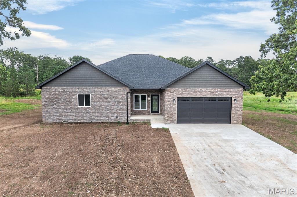 ALL ONE LEVEL! Beautiful New Construction in a Prestigious Lake Community. Discover how to relax and enjoy living in this stunning single level home located in an area with amazing views. Step inside to an open-concept floorplan that seamlessly connects the kitchen, dining and living areas.  Ideal for entertaining or every day living.  The kitchen features tile backsplash, ample counter space and a walk in pantry, while a dedicated storage room adds even more functionality.  This spacious home offers 4 large bedrooms with generously sized closets and 3 full bathrooms thoughtfully designed with tiled shower area over tubs As well as the primary suite that includes a spa inspired bathroom complete with a soaking tub, amazing tiled shower with 3 different types of shower heads and a walk-in closet for ultimate convenience. Enjoy modern design, quality craftsmanship and a peaceful lakeside community-all in one exceptional home. Come see if this is your next home!