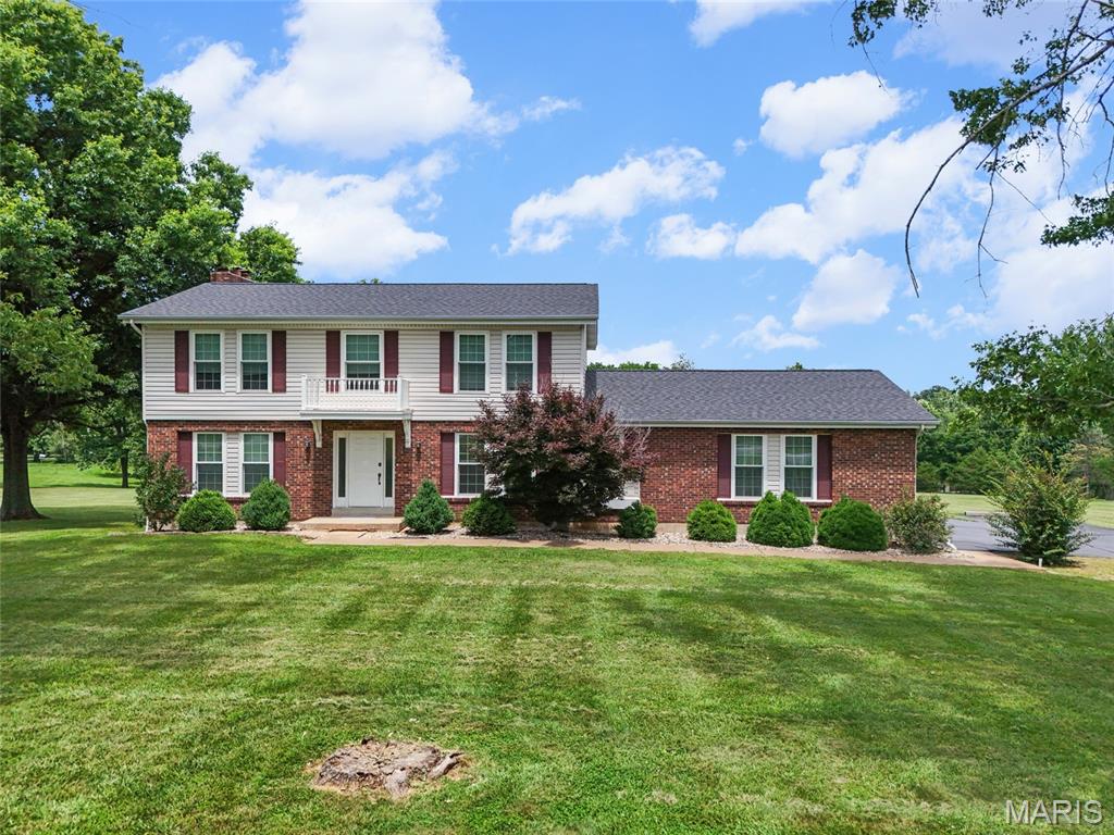 Acreage, privacy, and plenty of usable space come together in this 4 bedroom, 3.5 bath home located in the Festus School District. Sitting on just over 3 acres, the property offers a great mix of comfortable living space and outdoor room to enjoy. The main level has several areas for everyday living, entertaining, or working from home, including a front room that could be used as a dining room, office, playroom, or sitting area. The kitchen offers plenty of cabinet space and opens to a casual breakfast area, while the nearby family room features a cozy wood-burning fireplace. Main floor laundry adds extra convenience. 

Upstairs, you will find all four bedrooms, including a spacious primary suite with a private bath and walk-in closet. The walk-out basement gives you even more usable space with a family room, dry bar, full bathroom, and unfinished storage area. 

Outside, the large deck and lower patio provide great places to relax, grill, or entertain. There is also a fenced area that works well for pets or play space. The attached garage and separate workshop/outbuilding add extra room for vehicles, tools, hobbies, or equipment. This is a hard to come by property with acreage and a great location. Schedule your showing today!