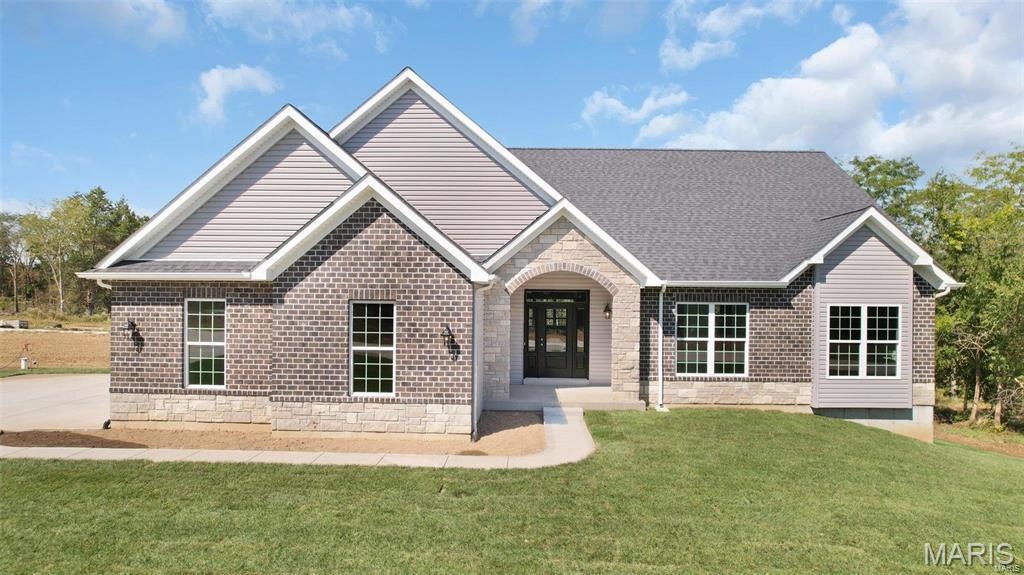 WELCOME HOME to The Estates at Schaper Farms!
TO BE BUILT – New Construction Luxury Acreage Homesites in St. Charles County, located in the Wentzville School District. Enjoy private 3+ acre wooded homesites offering space, privacy, and a peaceful setting.

This RANCH-style Sycamore plan has multiple elevations and includes a side-entry oversized 3-car garage (30’ x 24’). The open floor plan includes 9 ft ceilings (10 ft optional with transoms), an electric fireplace with a floor-to-ceiling stone surround, a 9 ft pour, and a 12’ x 12’ patio.

The kitchen offers 42” cabinetry, quartz or granite countertops, stainless steel appliances, and a walk-in pantry. The primary suite includes a luxury bath with split vanities, a separate soaking tub, and a walk-in shower. Two additional bedrooms and a full hall bath complete the main level.

This home includes many features as standard, with numerous optional upgrades available to personalize your build. City-maintained concrete streets throughout the subdivision.
Phase 1 map available in supplements.

? Luxury living in a country setting with an estimated build time of 5–6 months from contract to completion.