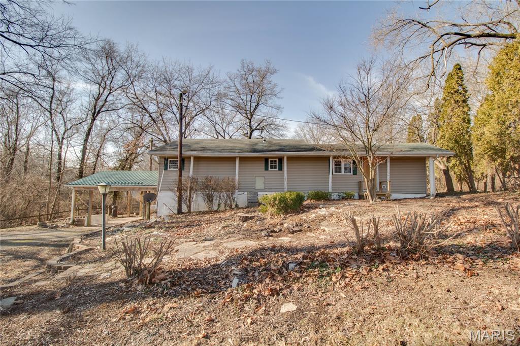 2 bed 1 bath mobile home on a permanent foundation (basement) sitting on a beautiful 0.89 ac. Large kitchen dining room combo,  added on Livingroom   and a large dry basement for plenty of storage. Large deck looking over a serene setting in the back with a shed and an outbuilding. This could be your own personal hobby farm with chickens, goats, horses or just to relax and enjoy the scenery. Conveniently located in Delhi between Jerseyville and Godfrey.

The title is in the process of being turned over to the owners so that the title can be surrendered to the state at closing making it Real residential property. Selling as is where is.