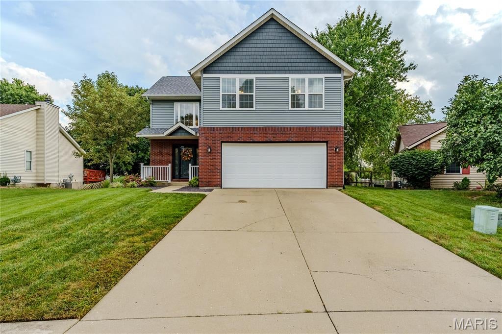 Absolutely beautiful and extensively updated 3-bedroom, 2.5-bath home located in a wonderful O’Fallon neighborhood! This home has undergone an impressive list of improvements, offering the perfect combination of updated style, comfortable living space, and major recent upgrades. The interior received a substantial refresh in 2025, including new flooring throughout the home (excluding the basement), new carpet on the main-level staircase, new baseboards, and fresh paint throughout—including ceilings, walls, doors, trim, baseboards, and staircase railing. Bathrooms have also been refreshed with new vanities, toilets, light fixtures, and remodeled showers/baths, along with new ceiling fans and lighting throughout. All new appliances were added in 2026. Major improvements include a new roof, siding, and whole-house wrapping/flashing completed in August 2025, along with a new furnace, sump pump, and skylights in 2024. The remodeled basement provides additional living and entertaining space, plus rough-in plumbing for a future bathroom already completed and ready to be framed and finished. Step outside to enjoy the composite deck overlooking the fenced backyard, perfect for relaxing or entertaining. Additional features include a 2-car garage and new exterior doors and lighting. With extensive updates completed from 2024–2026, beautiful finishes, great indoor and outdoor living space, and a fantastic location, 622 Rain Hollow is truly move-in ready and a home you won't want to miss! Call your favorite Realtor® today to schedule a private showing and be sure to ask for the complete list of improvements and updates made to this beautiful home.
