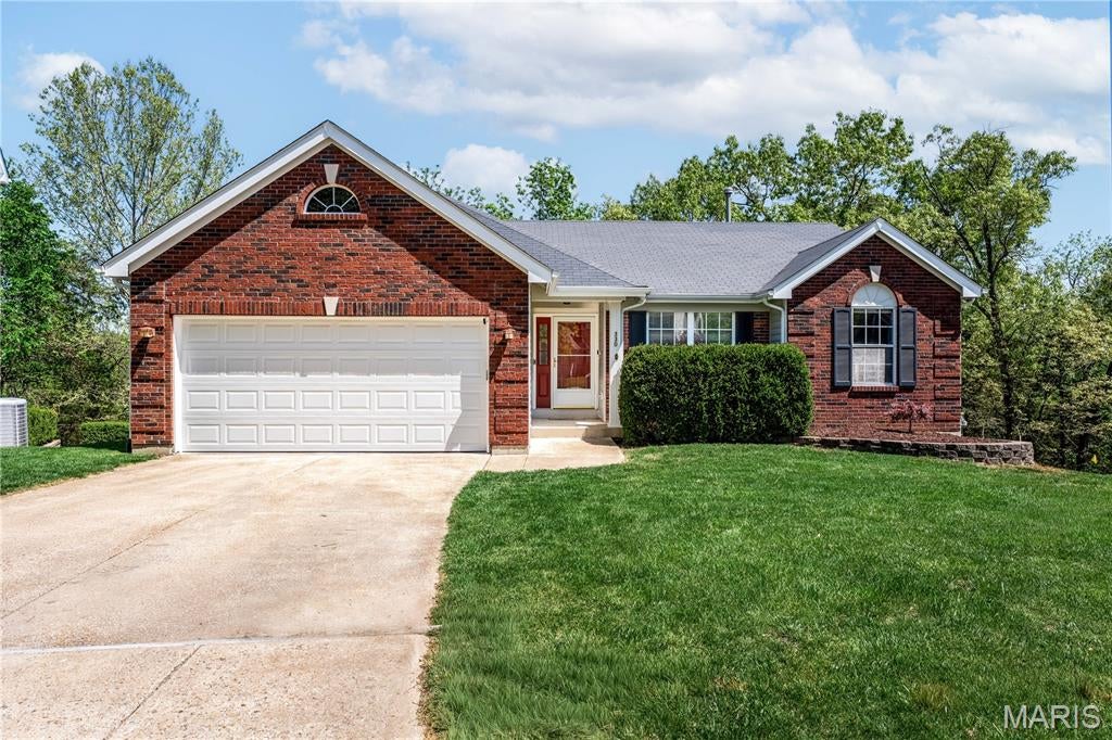 Located in the top-rated Rockwood School District, this truly move-in ready 3-bedroom, 2-bath atrium ranch has a finished lower-level offering a seamless blend of style, comfort, and everyday functionality.  Tucked away on a quiet cul-de-sac and backing to picturesque woods, this home provides a sense of privacy and tranquility. The spaces have been designed for the way you want to live-from a convenient main floor laundry to a versatile lower-level which includes a den and your own private theater room complete with surround sound and a fireplace for memorable movie nights.  The large studio area is perfect for martial arts, yoga, or other creative pursuits (and could even be a 4th bedroom),  along with a full bath rough-in.  The vaulted Great Room has a full wall of atrium windows framing tranquil, wooded views. A full masonry gas fireplace is perfect for enjoying a crisp evening.  The updated kitchen is both warm and functional with Smart home SS appliances that elevate everyday living—making shopping, cooking, and cleanup not just simple, but truly enjoyable.  The vaulted primary suite has a generous walk-in closet and an ensuite bath enhanced by surround sound and capturing those private, relaxing, wooded views for a spa-like experience.  Two additional bedrooms are thoughtfully positioned and share a nicely updated hall bath.  Step out to the expansive two-tier deck—easily accessed from both the dining area and the lower-level den-where you can savor morning coffee, enjoy relaxed outdoor dinners, or entertain guests while surrounded by peaceful, wooded views.  The deck has just been repaired and repainted so that everything has passed the Ballwin occupancy inspection.  The Roof is just 11 years old, and the HVAC equipment is in great shape. There are also a 2020 Water Heater and a 2023 Culligan Water Softener.  Built-in storage shelves in the utility area and in the oversized 2 car garage (which was recently enhanced with a LT warranty polyurea pebbled floor) provide plenty of extra storage.  This home is equipped with a load of security features as well.  Located within the neighborhood is the trailhead to the Roger Klamberg Woods Conservation Area, connecting you to miles of protected woodland trails and Bluebird Park’s amenities.  Other much loved Ballwin features include the North Pointe outdoor pool and recreation area, the community center and the Ballwin golf club.