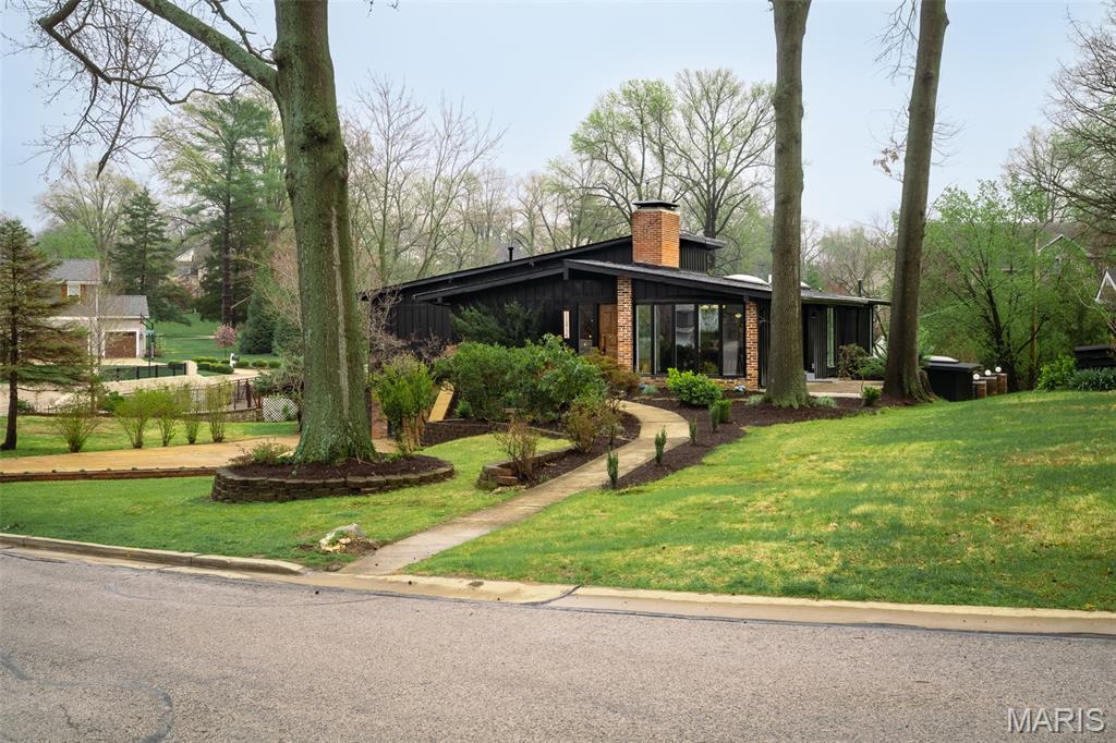 Stunning 4,300 sq ft mid-century modern in Des Peres, fully remodeled with all new electrical, plumbing, and roof. This 4 bed, 3 bath home blends timeless design with modern upgrades, featuring engineered wood floors, exposed beams, multiple fireplaces, and a bright, open layout.

The updated kitchen offers a large island, custom cabinetry, and seamless flow into the main living spaces—perfect for entertaining. Additional highlights include a dedicated gym, greenhouse, and spacious 2-car garage.

Step outside to a private backyard retreat with a rare 9-ft deep pool, surrounded by mature trees and an elevated setting.

A move-in ready mid-century home with style, space, and major updates—hard to find in this location.

Offers due 4/6/26 at 12pm