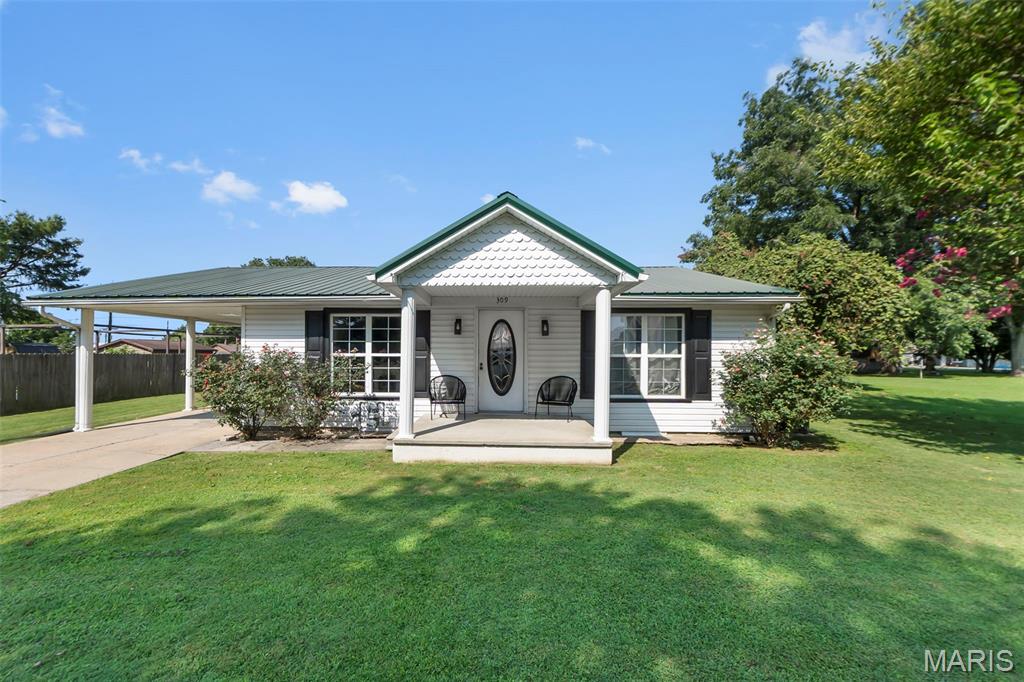 Bring your tools and your vision to 309 Garrett! Priced at $120,000, this 3-bedroom, 1.25-bath home offers 1,197 square feet and an opportunity for a buyer ready to finish renovations already underway. The home features updated flooring in several rooms, a usable kitchen, central heat, mini-split A/C, and a metal roof approximately 10 years old. Several projects remain for the next owner, including kitchen and bathroom flooring, completion of bathroom renovations, door trim and molding, and window replacement. Outside, you'll find a carport, large flat yard, and spacious storage shed with plenty of room for tools and equipment. With major renovation work already started, 309 Garrett offers a great opportunity for an investor, renovator, or handy buyer looking to put their own finishing touches on a property. Bring your ideas and make this one your own! This property is being sold AS-IS; please attach MO form MSC-2051R with offer.