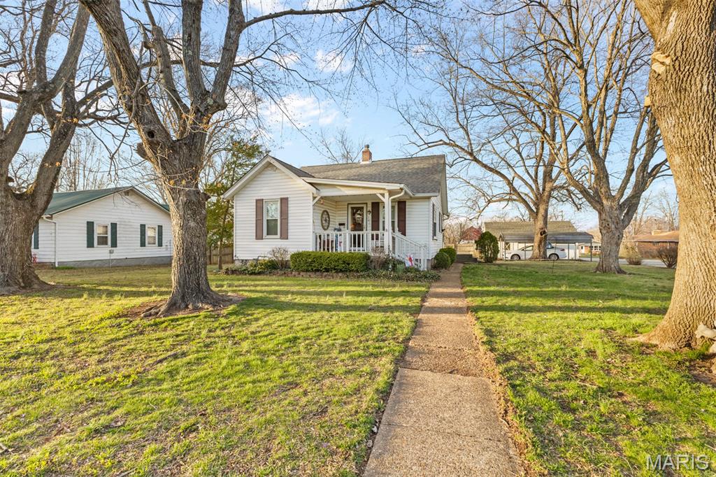 Charming 2 bed, 1 bath bungalow located in a great Farmington neighborhood! This cute home would make a perfect starter home with plenty of potential. Features include a spacious 2 car garage plus an additional carport for extra parking or storage. Don't miss the chance to own this cozy home in a desirable location!