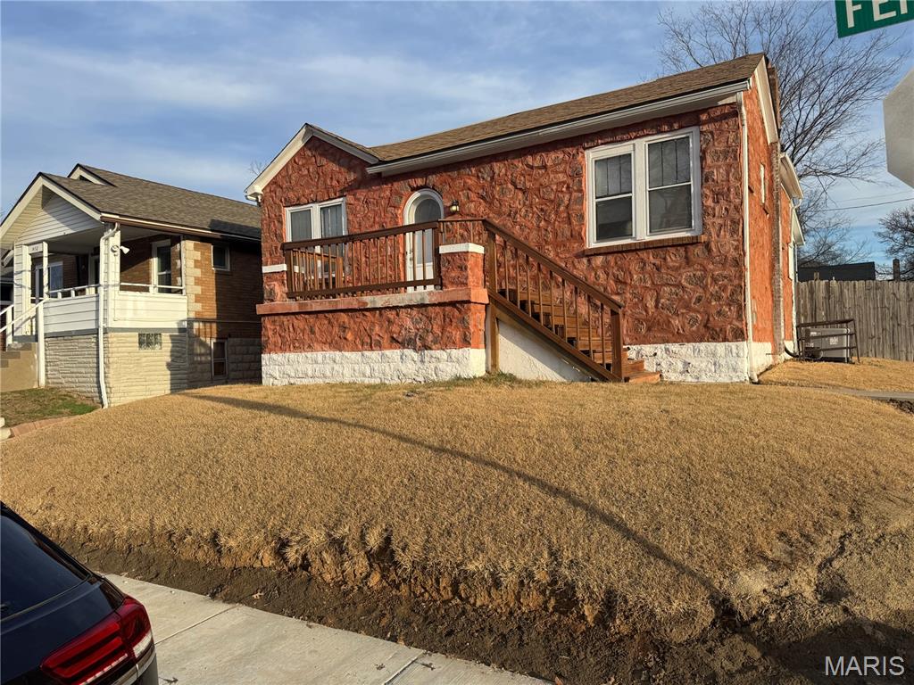 Updated 3 bed 1 bath with Original Hardwood Floors and updated luxury Vinyl.  New Cabinents and counter top. Main Floor Laundry.  Off street parking