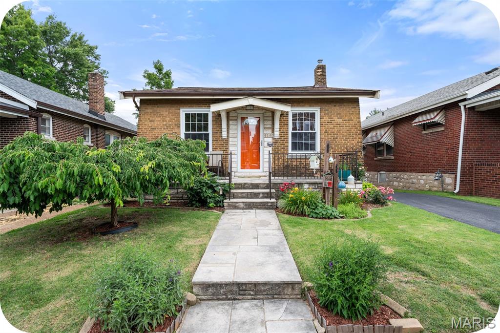 You are going to LOVE this home! It is just too darned cute in every possible way! Located in the popular Tower Grove South neighborhood close to parks, restaurants, shopping and more this house is a slam dunk! As soon as you pull up you will notice how much love and care has gone into maintaining this sweet south city bungalow.  Open the front door and walk into a spacious, bright and cheerful living room with hardwood floors, stained glass windows and decorative fireplace. The living room leads into a large formal dining room perfect for hosting friends and family. The updated kitchen is BEAUTIFUL! So thoughtfully laid out with tons of storage, stainless appliances, and granite countertops. Two good-sized bedrooms and an updated bathroom are the icing on the cake! Off the kitchen you will find the most delightful, enclosed porch overlooking a back yard city oasis with beautiful flowers, bushes and a 1 car garage. The unfinished basement is clean and dry and has a ton of potential. Finish it off or just use it as it currently is for storage and laundry. All systems are in good working order, and the roof is less than 1 year old! This cozy bungalow feels like 'home' and won't last long. Make your appointment today!