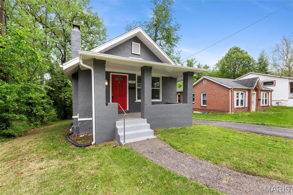 Add to your investment portfolio. This updated 2 bedroom 1 bathroom bungalow in St John with a tenant in place through .  You'll love evenings on the inviting front porch. Step inside to the living room with hardwood floors and brick mantle.  The large eat-in kitchen features tile floors, arched doorways and plenty of cabinets. Both bedrooms have newer carpeting. The bathroom features newer vanity, tub surround and vinyl plank flooring. Downstairs is an open unfinished walk-out basement- waiting for your vision! Updated in 2022, with new roof, gutters, fascia, HVAC, electric panel, windows & fresh paint. Large backyard with plenty of room to play.  Convenient access to 170. Schedule a showing today!