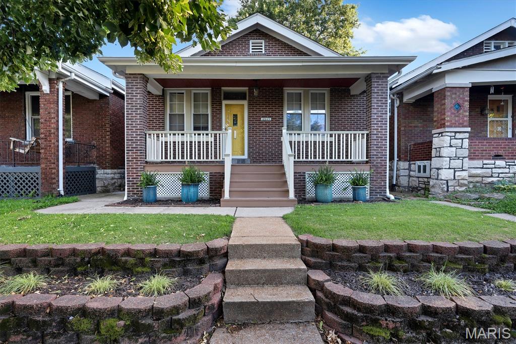 Some homes are updated. Others are thoughtfully elevated. At 4948 Nagel Avenue, the character and craftsmanship of a bygone era have been carefully preserved while seamlessly blending with the comforts and expectations of modern living.

Originally built in 1922, this remarkable residence has been transformed into one of the most exceptional homes in the area. From the moment you step inside, the home reveals details that tell a story—original stained-glass windows, a striking harlequin-pattern tile foyer, and architectural elements that honor the home's heritage while creating a setting that feels both timeless and fresh.

With more than 1,400 square feet of living space on the main level, the home lives larger than expected. The spacious primary suite offers a true retreat, complete with a walk-in closet featuring convenient laundry access. The spa-inspired bath was designed for relaxation, featuring a soaking tub, separate shower, double-bowl vanity, and classic subway tile surrounds that feel both elegant and enduring.

At the heart of the home, the kitchen blends beauty and function with 42-inch cabinetry, glass-front display cabinets, oversized crown molding, illuminated cabinet accents, stainless steel appliances, a gas range, and a center island that naturally becomes a gathering place for family and friends.

The thoughtfully designed addition creates a stunning living space filled with natural light. Vaulted ceilings soar overhead while an abundance of windows and transoms draw the outdoors in. Whether enjoying a quiet morning coffee, gathering with loved ones, or watching your four-legged family member keep an eye on the neighborhood wildlife from their favorite sunny perch, the space feels warm, inviting, and connected to nature.

Outside, established landscaping surrounds the home, while the fenced backyard provides privacy and room to enjoy the seasons. The covered front porch offers a welcoming place to slow down and enjoy the neighborhood. In addition to the detached two-car garage, an extra parking pad provides valuable off-street parking for guests, hobbies, or additional vehicles.

The walk-up lower level adds even more versatility with a full bath, abundant storage, and expansive flex space ready to adapt to your needs—whether future living space, a home gym, workshop, creative studio, or recreation area.

Homes like this rarely come along. Rich with character, thoughtfully updated, and beautifully balanced between historic charm and modern functionality, 4948 Nagel Avenue offers the opportunity to own a home that has been lovingly elevated while remaining true to the architectural details that make it special.