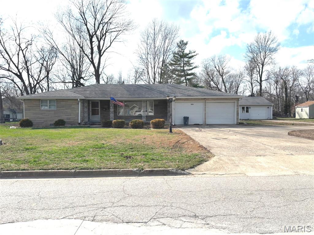This home has that fabulous, unable to be replicated, sweet 1960's solid, heavy, quality build feel. Featuring Bedford stone and a HUGE open living area. Walk-in shower, new kitchen cabinets, 2 car attached garage and large detached garage, concrete drive. Large front porch for people watching, oversize, deep backyard with plenty of room for garden, pool, swing-set, trampoline or all four!